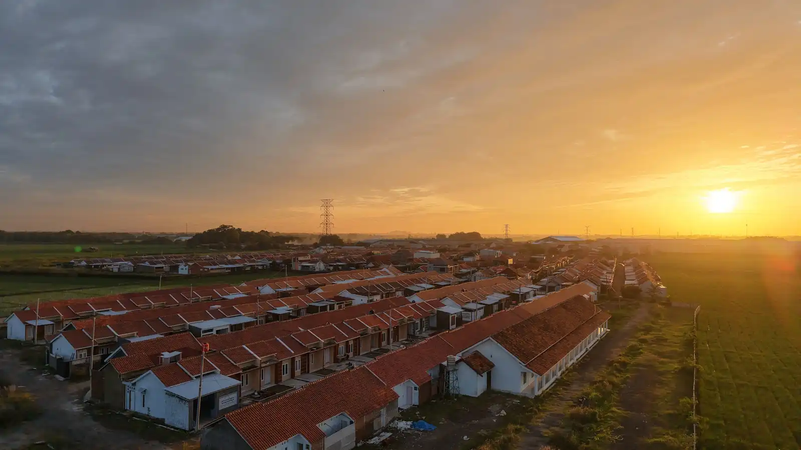 An aerial view of a village at sunset